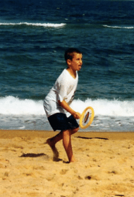 William Mancini playing on the beach